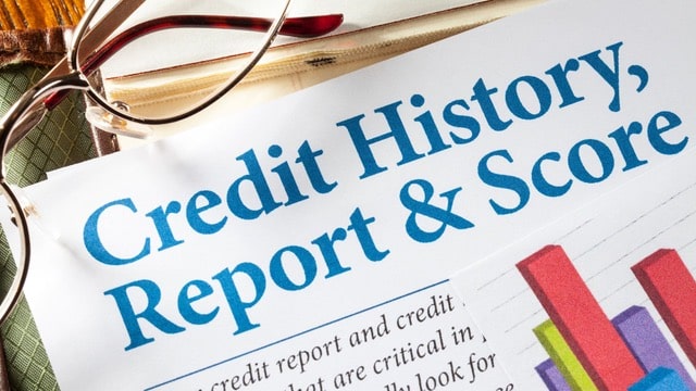 A document titled 'Credit History, Report & Score' with a pair of glasses and colorful bar charts, illustrating the concept of rent payment reporting to credit bureaus.