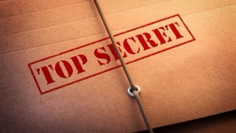 Top secret stamped on a brown envelope, symbolizing the hidden power of joining a real estate community for success.